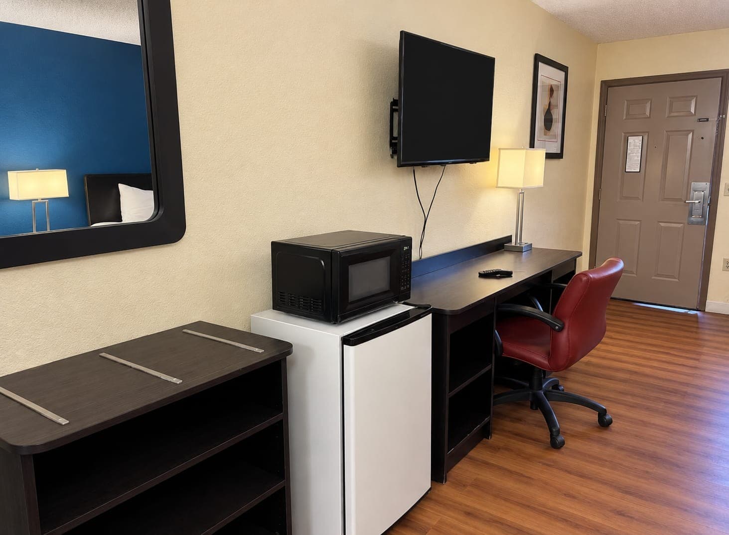 Mountain Inn room — work desk, flat-screen TV, mini-fridge and microwave